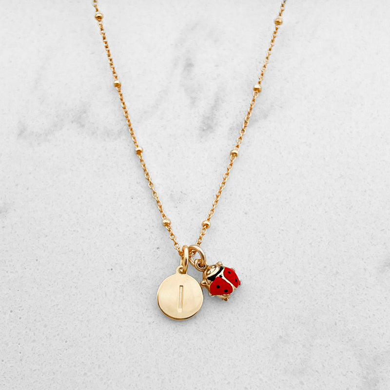 Collana coccinella e charm lettera in argento 925